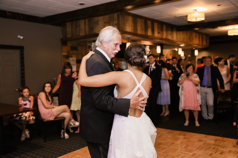 father and daughter dance during wedding reception