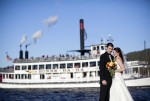 Steamboat in the background of wedding photo