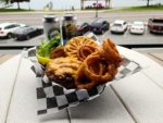 Cheeseburger with onion rings and local beer