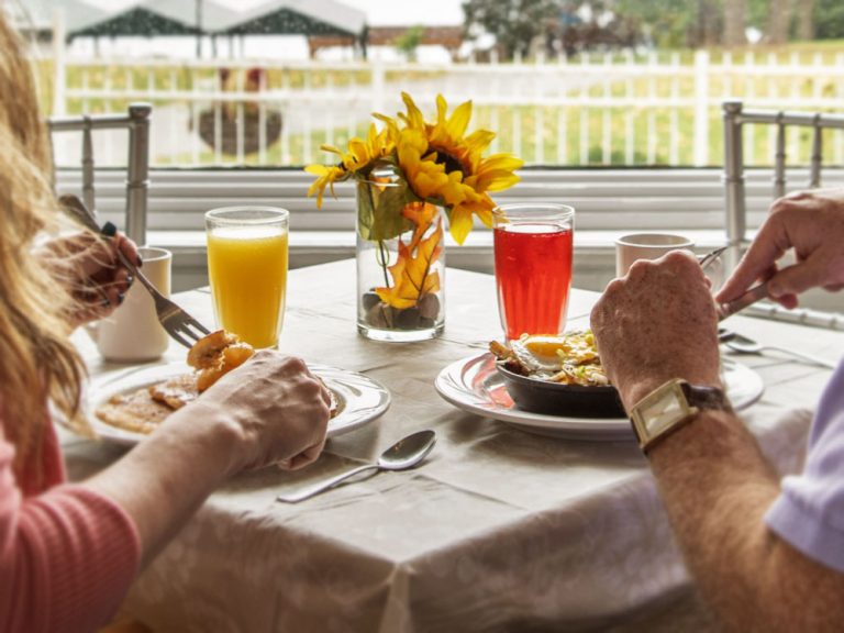 couple eating breakfast on patio