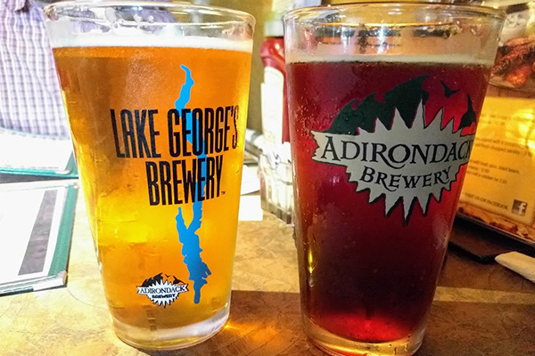 two pints of adirondack brewery beer