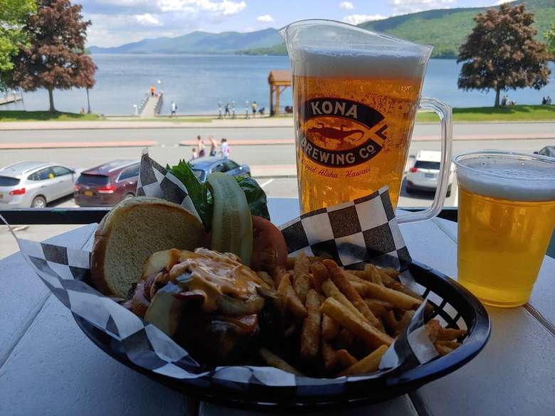 Burger, Fries and Beer on table overlooking Lake George