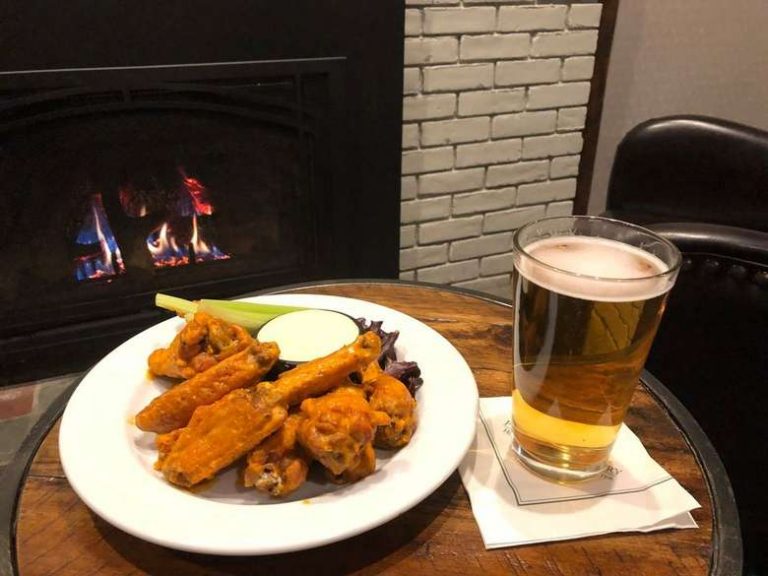 wings and beer in front of fireplace