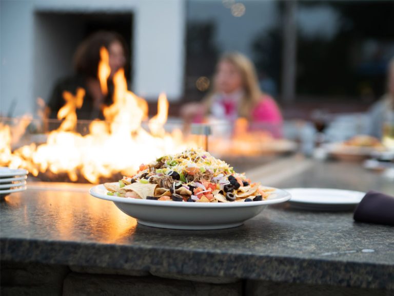 Nachos on table next to firetable