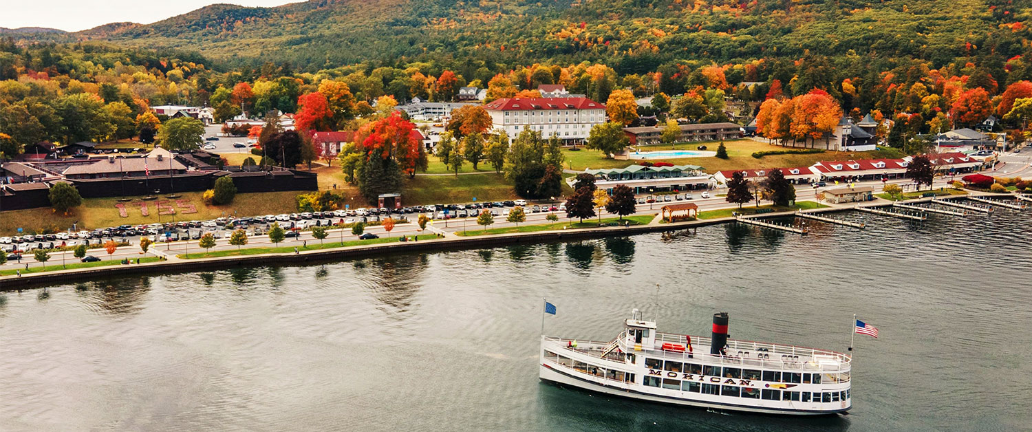 steamboat on lake george in front of fort william henry in the fall