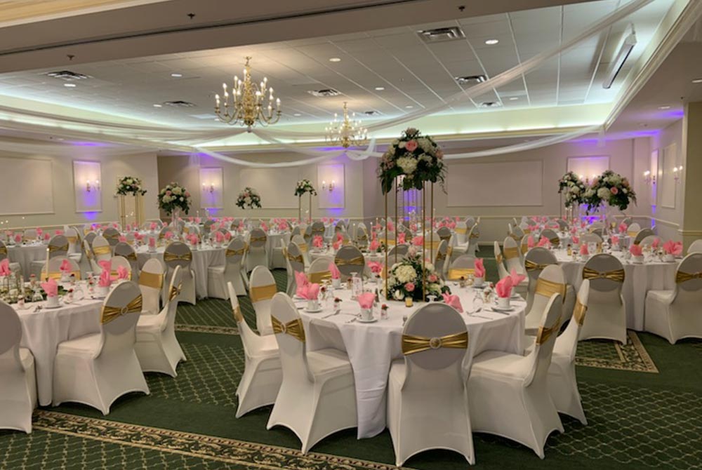 Wedding ballroom setup with dining tables