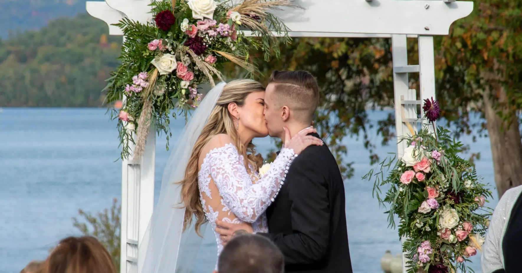 Bride and groom kissing after ceremony