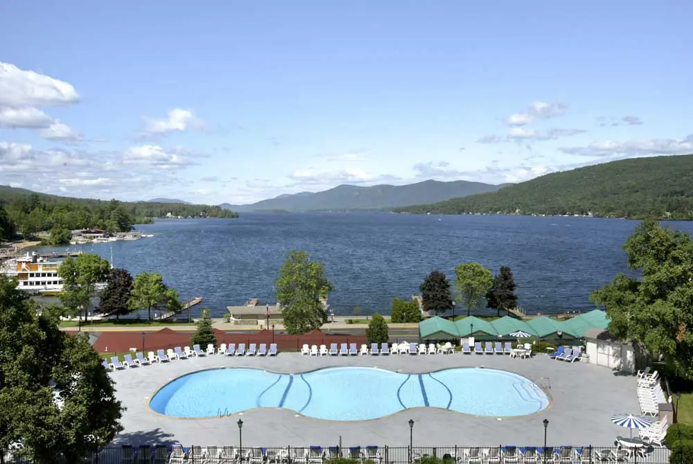 aerial view overlooking the outdoor pool and Lake George